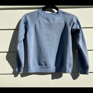 a light blue urban outfitters crewneck